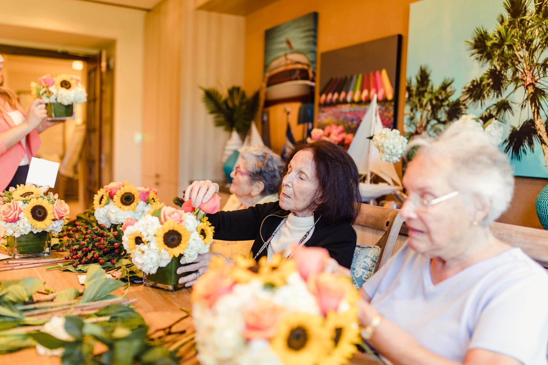 elderly women arranging flowers