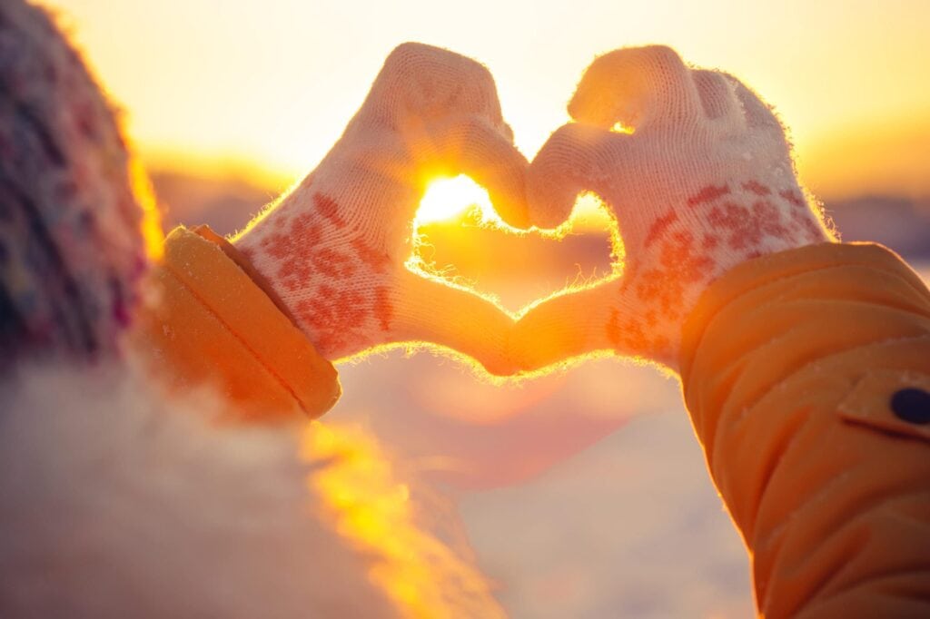 gloved hands making heart shape