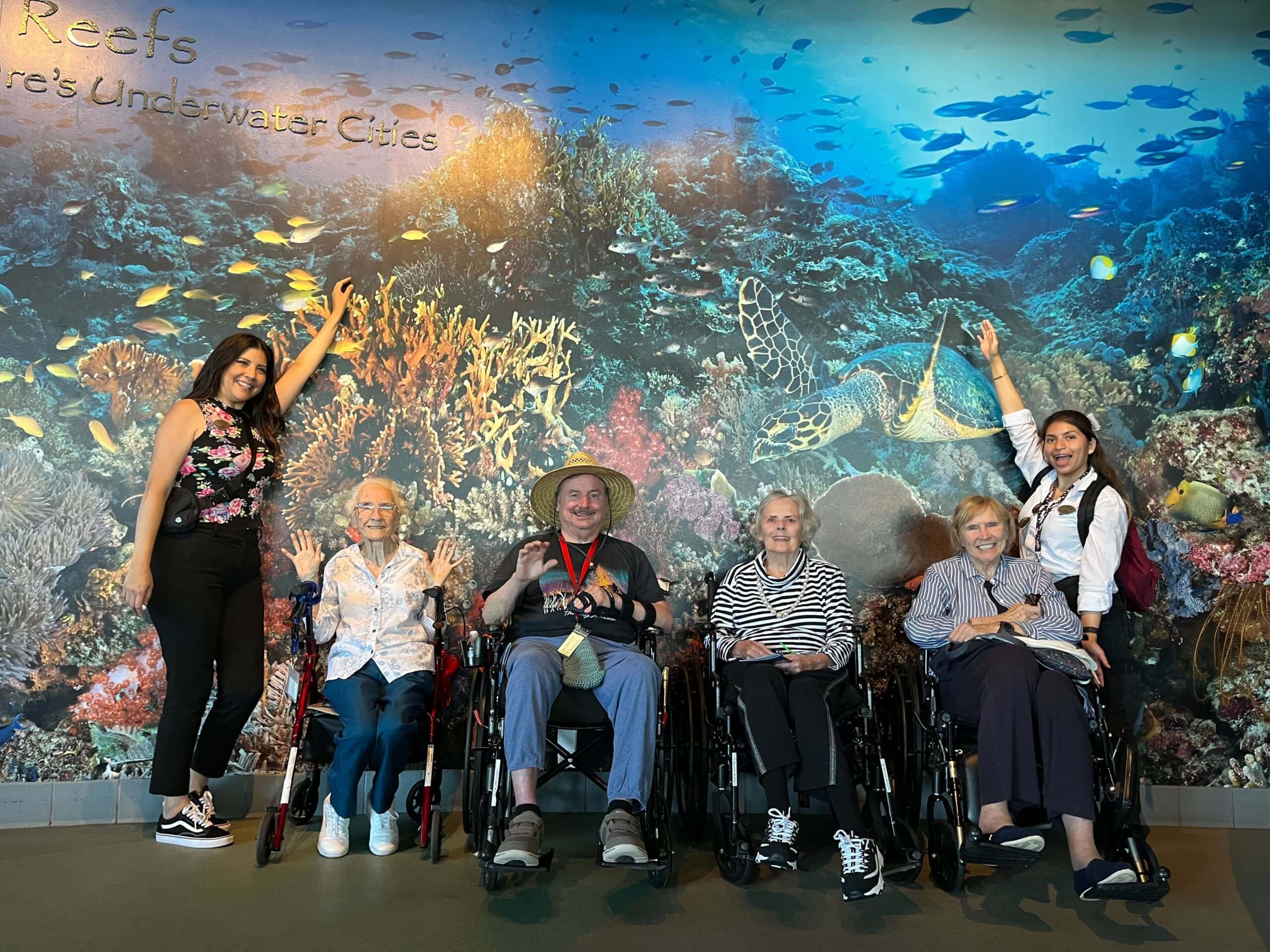 residents and care team members at aquarium