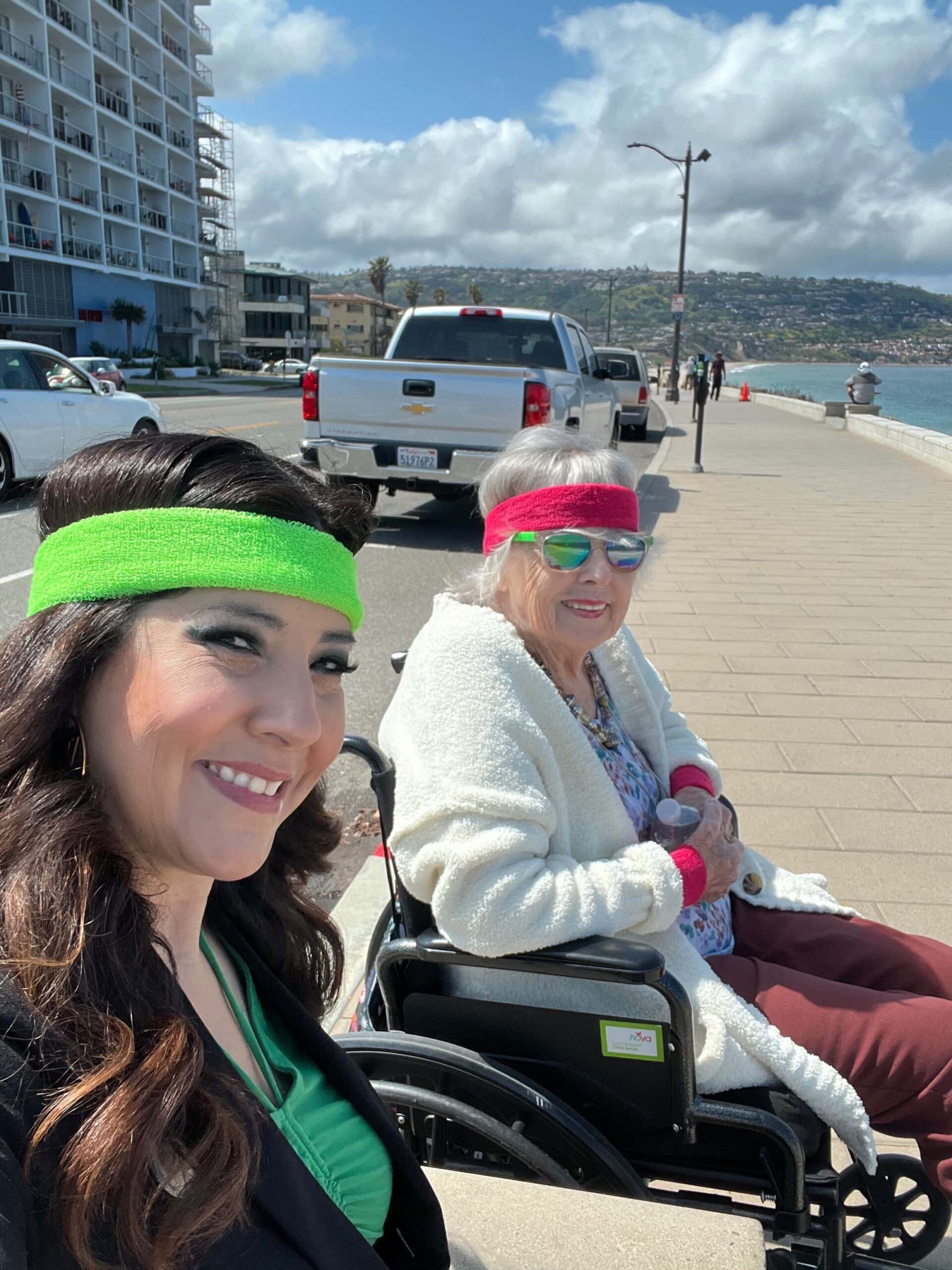 resident and care team member looking at water view