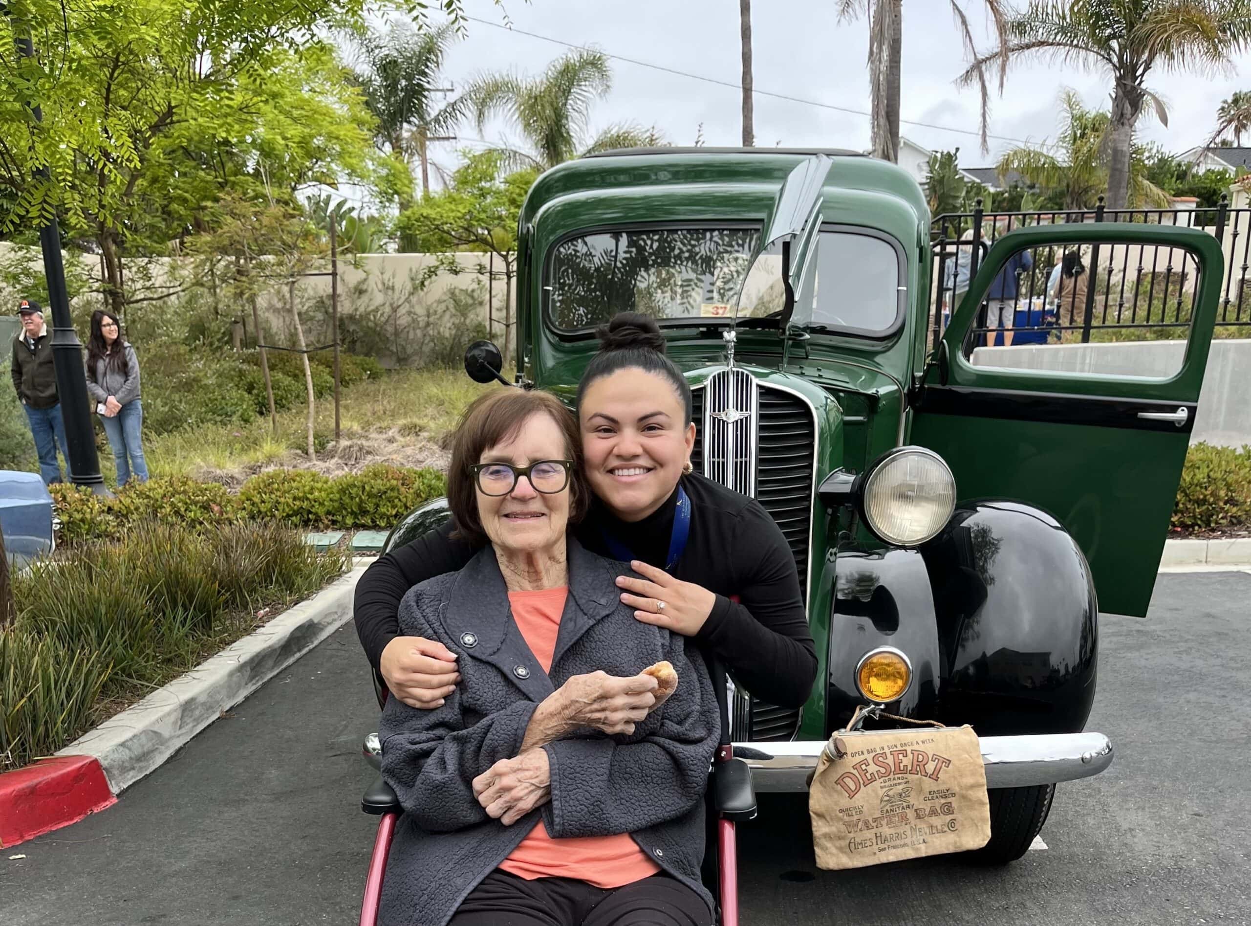 care team and resident during car show