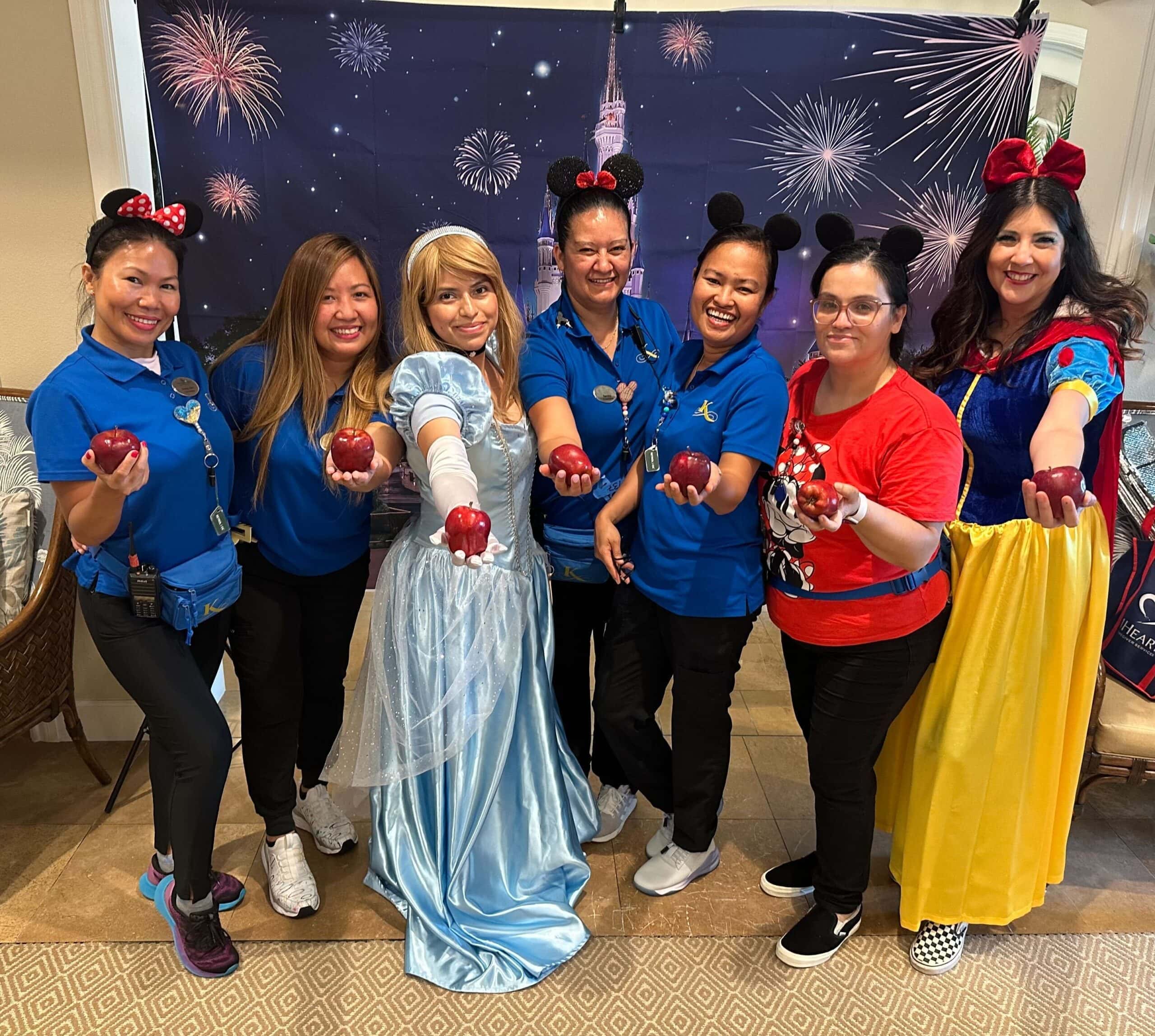 team members dressed in costumes for Disney event