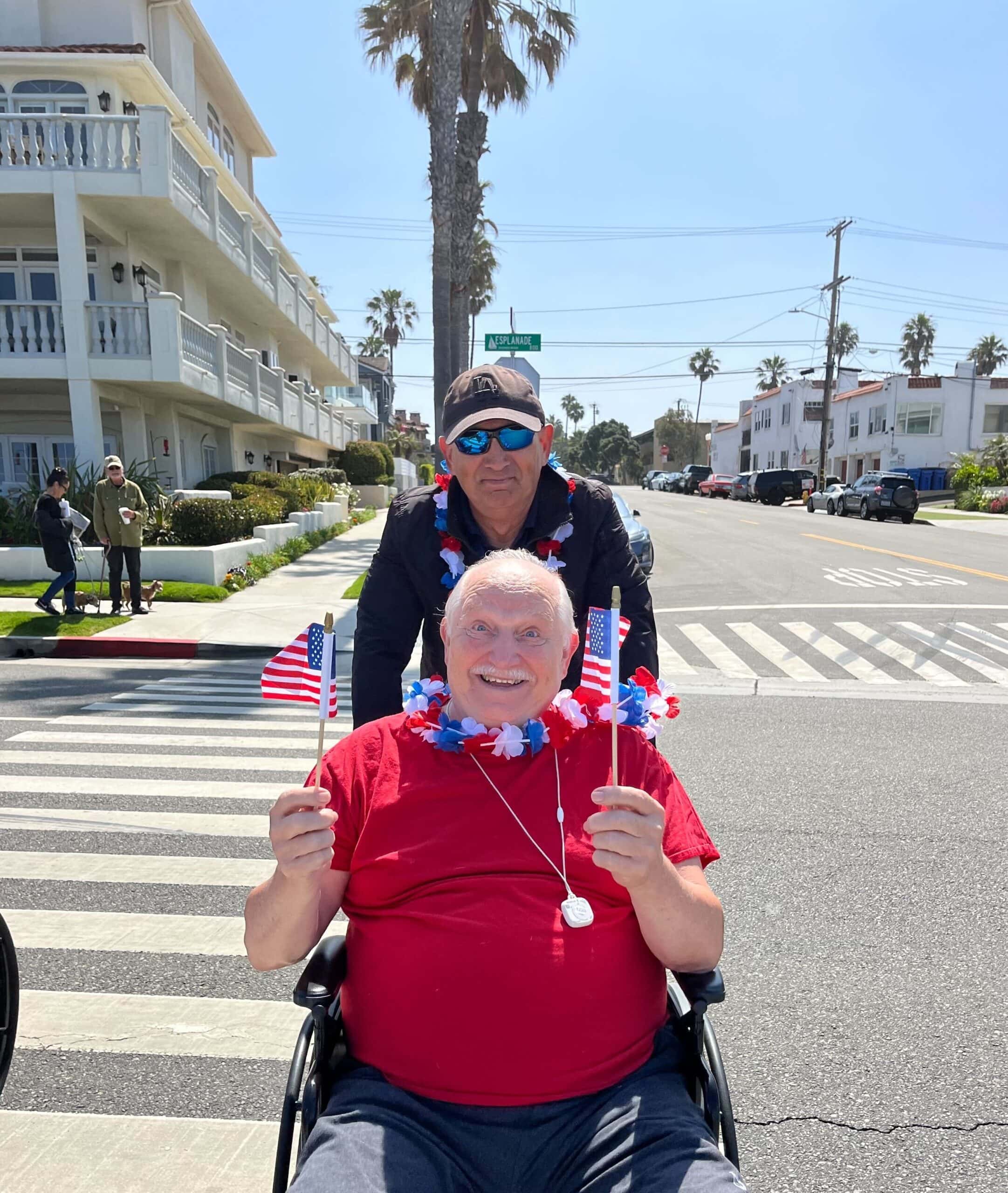 resident and care team member on patriotic outing