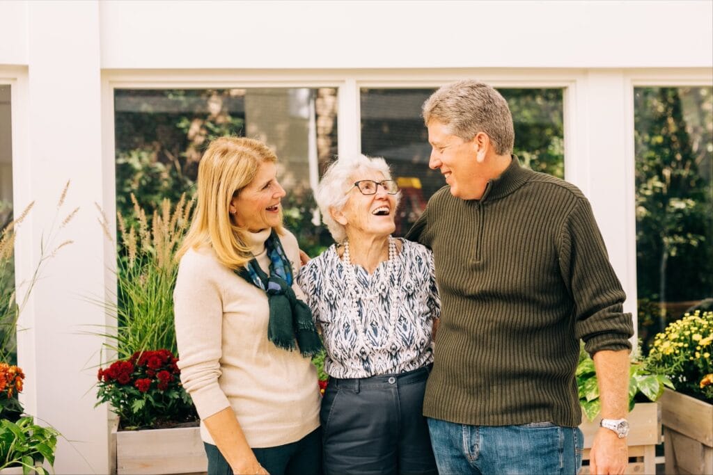 older woman with adult couple