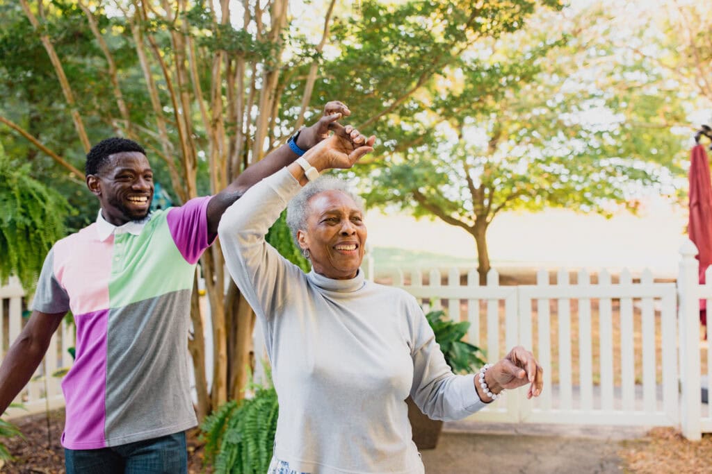 young man and older woman dancing
