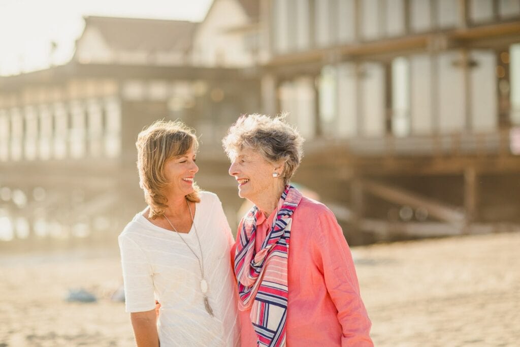 a senior and team member enjoying kensingtons coastal setting