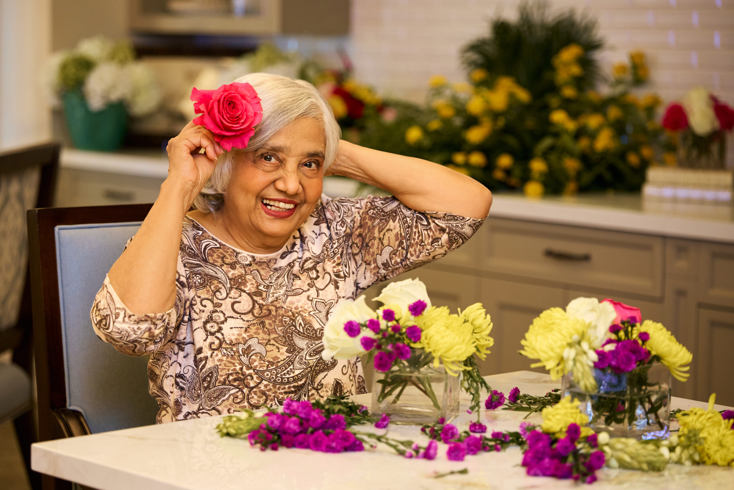 Senior woman working on flower arrangements